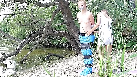 Girl Tied And Gagged In Trashbags On The Beach Girl Tied And Gagged In Trashbags On The Beach